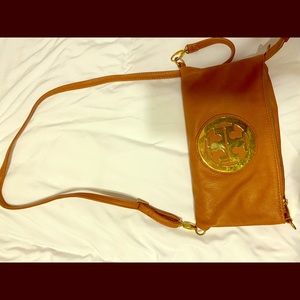 Fake Tory Burch bag. Tan color with gold detail.
